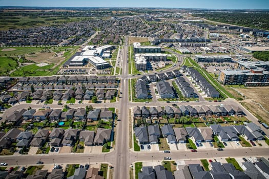 Captivating aerial shot of Stonebridge in Saskatoon, highlighting the harmonious blend of modern architecture and Saskatchewan's verdant surroundings.