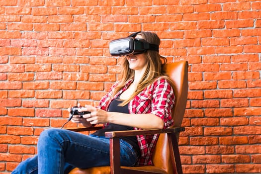 Woman play video game with joystick with VR device.