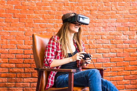 Woman play video game with joystick with VR device.