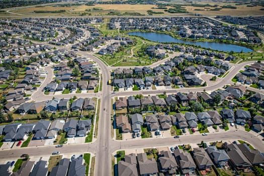 Captivating aerial shot of Stonebridge in Saskatoon, highlighting the harmonious blend of modern architecture and Saskatchewan's verdant surroundings.