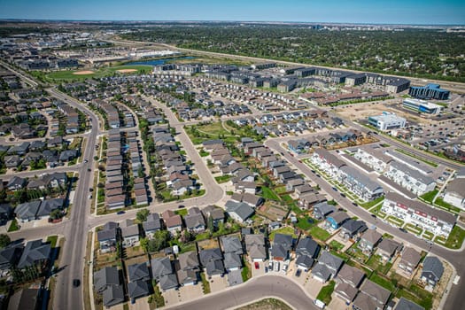 Captivating aerial shot of Stonebridge in Saskatoon, highlighting the harmonious blend of modern architecture and Saskatchewan's verdant surroundings.