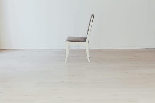 gray chair in the interior of an empty room