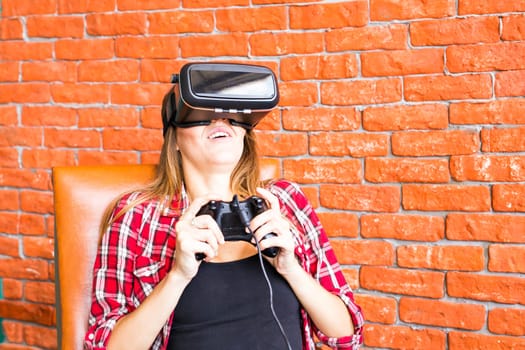 Woman play video game with joystick with VR device.