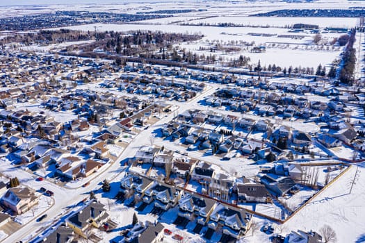 Explore the lush Forest Grove neighborhood in Saskatoon from an aerial perspective. This drone image captures the area's verdant charm, peaceful streets, and community warmth, under the vast Saskatchewan sky.