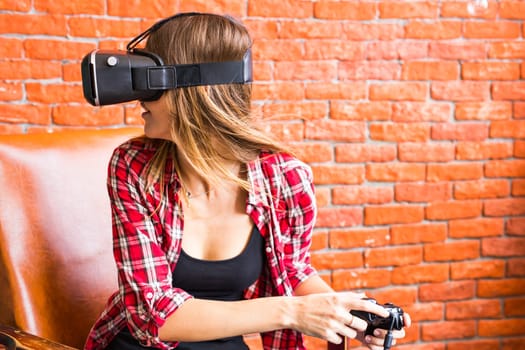 Woman play video game with joystick with VR device.