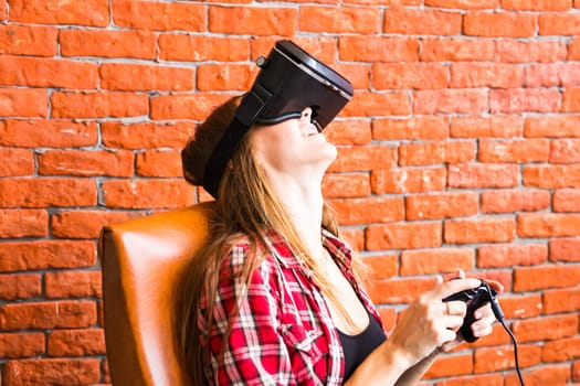 Woman play video game with joystick with VR device.