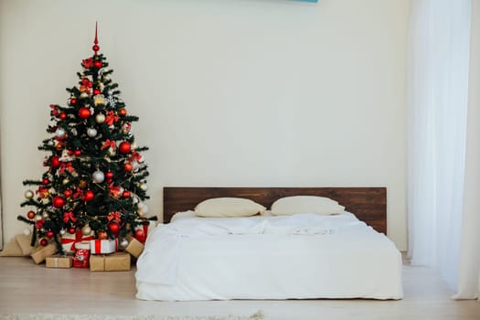 decor white bedroom with Christmas tree Christmas gifts 1