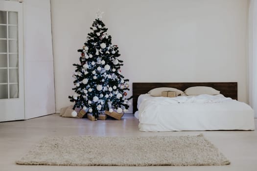 bedroom with rozhdetvenskim new year tree decoration bed