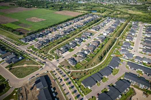 Stunning bird's-eye perspective of the Evergreen neighborhood in Saskatoon, showcasing the unique urban layout and the natural beauty of Saskatchewan's landscapes.