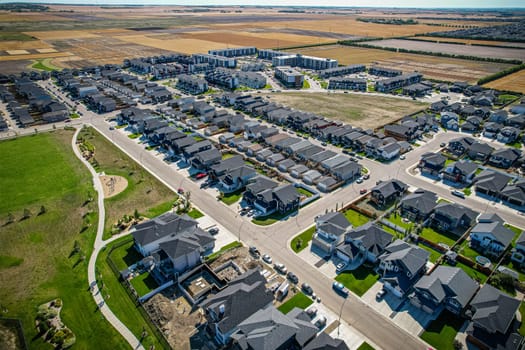 Stunning bird's-eye perspective of the Evergreen neighborhood in Saskatoon, showcasing the unique urban layout and the natural beauty of Saskatchewan's landscapes.