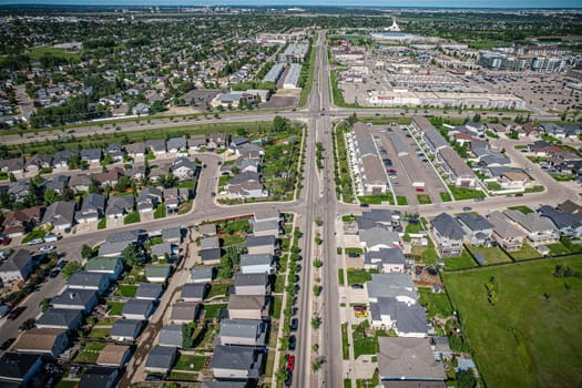 Elevated panorama of Willowgrove, showcasing the neighborhood's modern aesthetics intertwined with pockets of lush green, epitomizing Saskatoon's suburban beauty