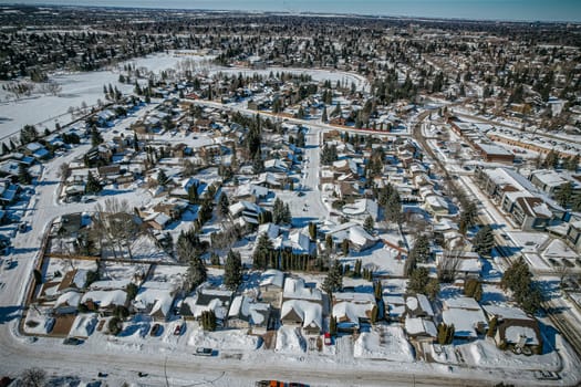 Soaring over Lakeview in Saskatoon, this bird's-eye capture magnifies the neighborhood's tranquil waters, verdant parks, and the serene rhythm of Saskatchewan living