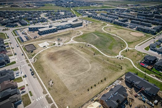 Stunning bird's-eye perspective of the Evergreen neighborhood in Saskatoon, showcasing the unique urban layout and the natural beauty of Saskatchewan's landscapes.