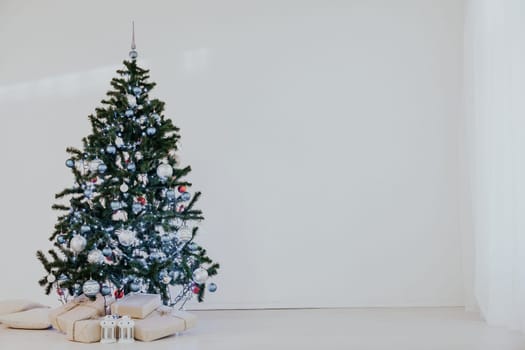 Christmas tree on Christmas day in a white room with gifts 1