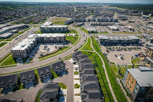 Captivating aerial shot of Stonebridge in Saskatoon, highlighting the harmonious blend of modern architecture and Saskatchewan's verdant surroundings.