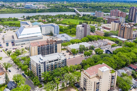 Discover the vibrant City Park neighborhood in Saskatoon from above. This drone image captures its lush green spaces, historic charm, and lively urban atmosphere, offering a unique aerial perspective.