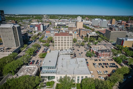Aerial spectacle of downtown Saskatoon, revealing the city's architectural marvels, bustling streets, and the pulsating core of Saskatchewan's metropolis