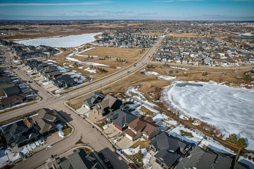 Captivating aerial shot of Stonebridge in Saskatoon, highlighting the harmonious blend of modern architecture and Saskatchewan's verdant surroundings.