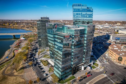 Aerial spectacle of downtown Saskatoon, revealing the city's architectural marvels, bustling streets, and the pulsating core of Saskatchewan's metropolis