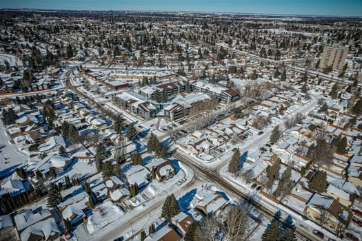 Soaring over Lakeview in Saskatoon, this bird's-eye capture magnifies the neighborhood's tranquil waters, verdant parks, and the serene rhythm of Saskatchewan living