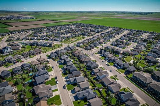 Elevated panorama of Willowgrove, showcasing the neighborhood's modern aesthetics intertwined with pockets of lush green, epitomizing Saskatoon's suburban beauty