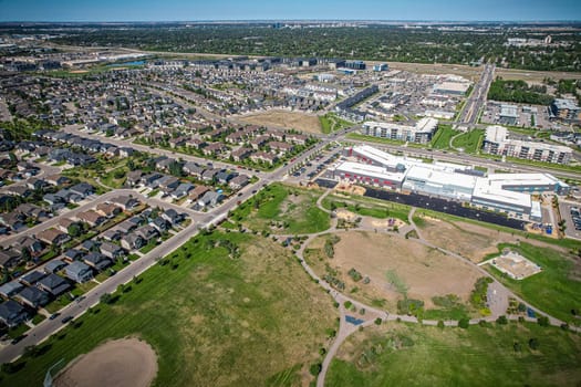 Captivating aerial shot of Stonebridge in Saskatoon, highlighting the harmonious blend of modern architecture and Saskatchewan's verdant surroundings.