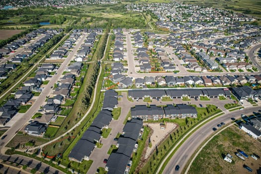 Stunning bird's-eye perspective of the Evergreen neighborhood in Saskatoon, showcasing the unique urban layout and the natural beauty of Saskatchewan's landscapes.
