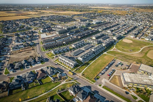 Stunning bird's-eye perspective of the Evergreen neighborhood in Saskatoon, showcasing the unique urban layout and the natural beauty of Saskatchewan's landscapes.
