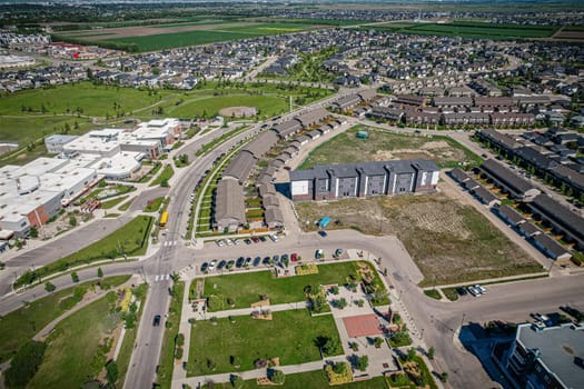 Elevated panorama of Willowgrove, showcasing the neighborhood's modern aesthetics intertwined with pockets of lush green, epitomizing Saskatoon's suburban beauty