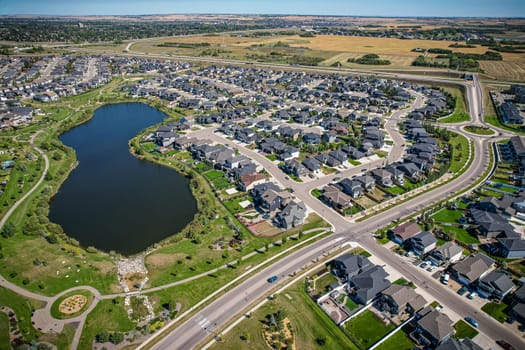 Captivating aerial shot of Stonebridge in Saskatoon, highlighting the harmonious blend of modern architecture and Saskatchewan's verdant surroundings.