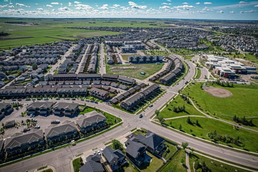 Elevated panorama of Willowgrove, showcasing the neighborhood's modern aesthetics intertwined with pockets of lush green, epitomizing Saskatoon's suburban beauty