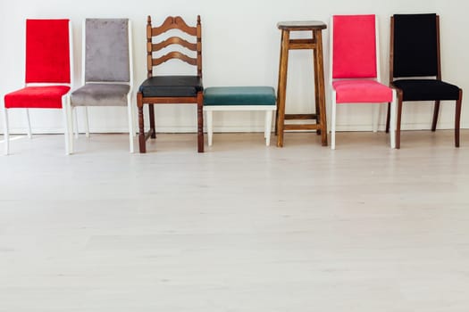seven chairs in the interior of an empty room