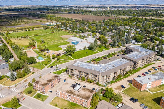 Experience the charm of Greystone Heights in Saskatoon from the sky. This drone image beautifully captures the neighborhood's serene streets, lush parks, and the cohesive community atmosphere.