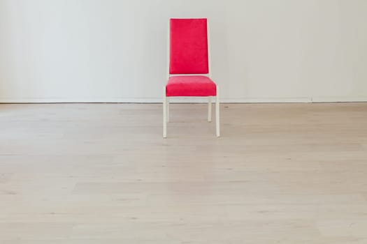 pink chair in the interior of an empty room