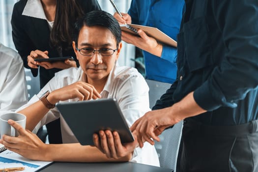 Group of diverse office worker employee working together on strategic business marketing planning in corporate office room. Positive teamwork in business workplace concept. Prudent