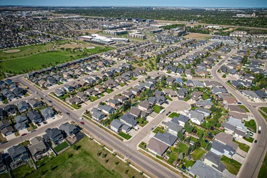Captivating aerial shot of Stonebridge in Saskatoon, highlighting the harmonious blend of modern architecture and Saskatchewan's verdant surroundings.