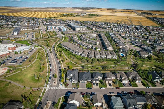 Elevated panorama of Willowgrove, showcasing the neighborhood's modern aesthetics intertwined with pockets of lush green, epitomizing Saskatoon's suburban beauty