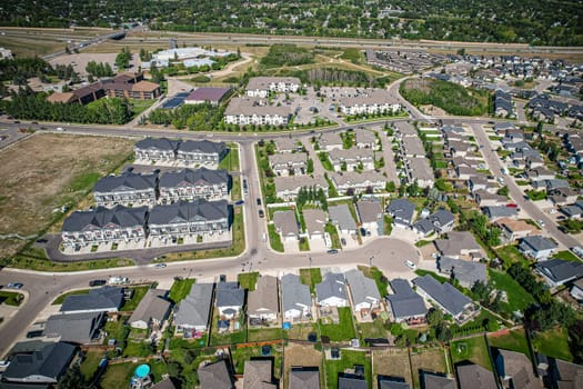 Captivating aerial shot of Stonebridge in Saskatoon, highlighting the harmonious blend of modern architecture and Saskatchewan's verdant surroundings.