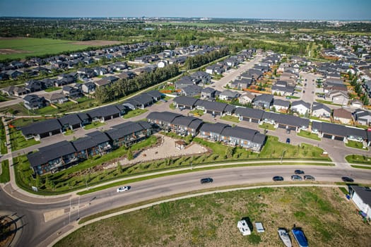 Stunning bird's-eye perspective of the Evergreen neighborhood in Saskatoon, showcasing the unique urban layout and the natural beauty of Saskatchewan's landscapes.