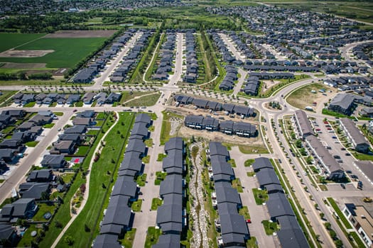 Stunning bird's-eye perspective of the Evergreen neighborhood in Saskatoon, showcasing the unique urban layout and the natural beauty of Saskatchewan's landscapes.