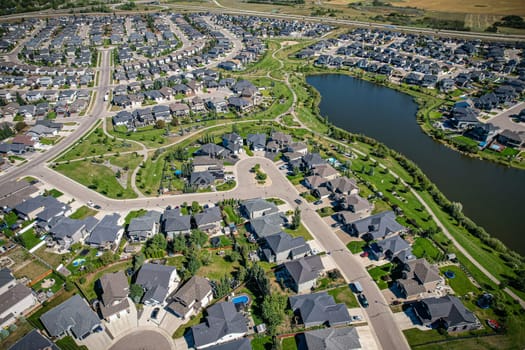 Captivating aerial shot of Stonebridge in Saskatoon, highlighting the harmonious blend of modern architecture and Saskatchewan's verdant surroundings.