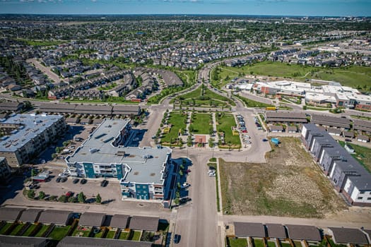 Elevated panorama of Willowgrove, showcasing the neighborhood's modern aesthetics intertwined with pockets of lush green, epitomizing Saskatoon's suburban beauty