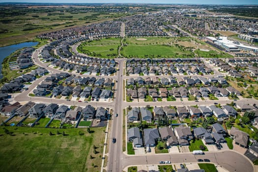 Captivating aerial shot of Stonebridge in Saskatoon, highlighting the harmonious blend of modern architecture and Saskatchewan's verdant surroundings.