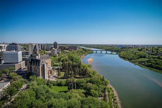 Aerial spectacle of downtown Saskatoon, revealing the city's architectural marvels, bustling streets, and the pulsating core of Saskatchewan's metropolis