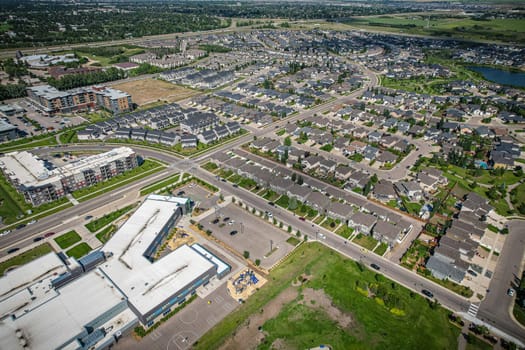 Captivating aerial shot of Stonebridge in Saskatoon, highlighting the harmonious blend of modern architecture and Saskatchewan's verdant surroundings.