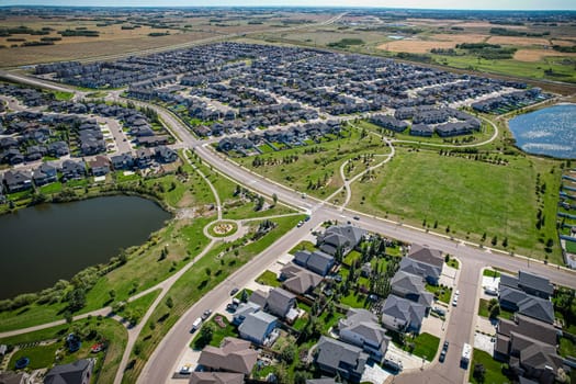 Captivating aerial shot of Stonebridge in Saskatoon, highlighting the harmonious blend of modern architecture and Saskatchewan's verdant surroundings.