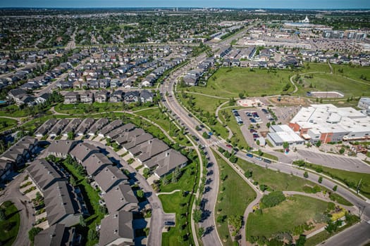 Elevated panorama of Willowgrove, showcasing the neighborhood's modern aesthetics intertwined with pockets of lush green, epitomizing Saskatoon's suburban beauty