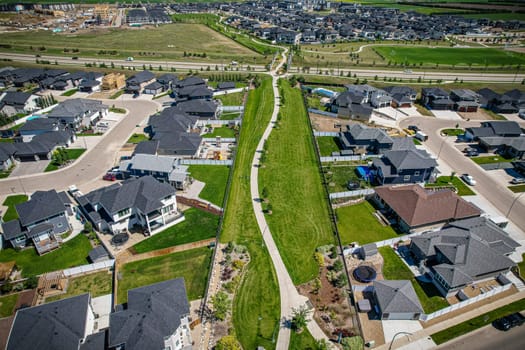 Stunning bird's-eye perspective of the Evergreen neighborhood in Saskatoon, showcasing the unique urban layout and the natural beauty of Saskatchewan's landscapes.