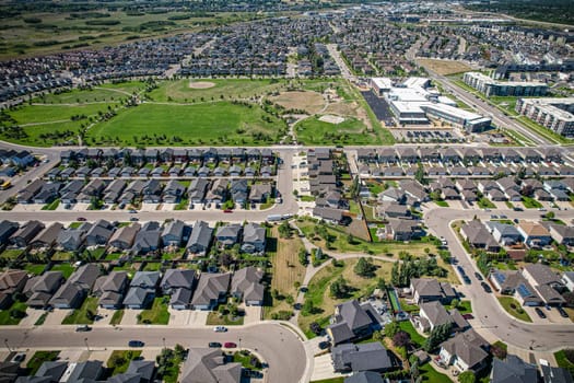 Captivating aerial shot of Stonebridge in Saskatoon, highlighting the harmonious blend of modern architecture and Saskatchewan's verdant surroundings.