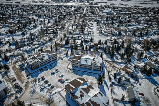 Soaring over Lakeview in Saskatoon, this bird's-eye capture magnifies the neighborhood's tranquil waters, verdant parks, and the serene rhythm of Saskatchewan living